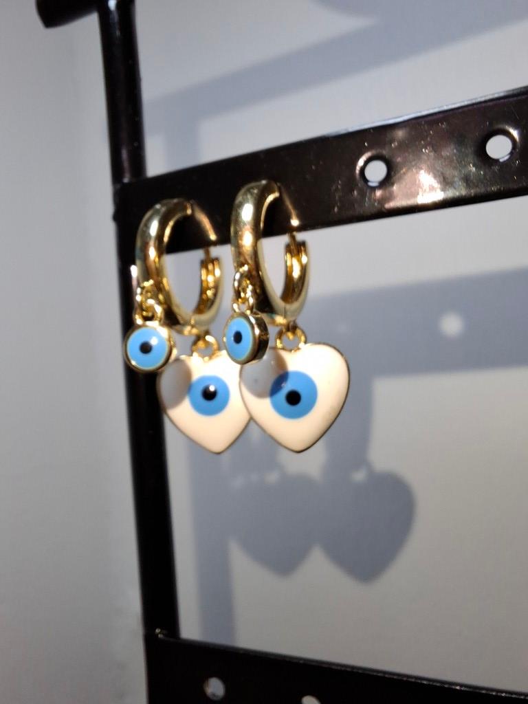 Aretes dorados corazones ojo