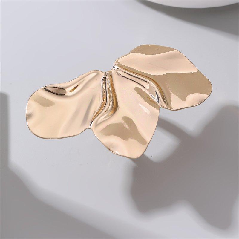 Anillo de acero dorado de flor
