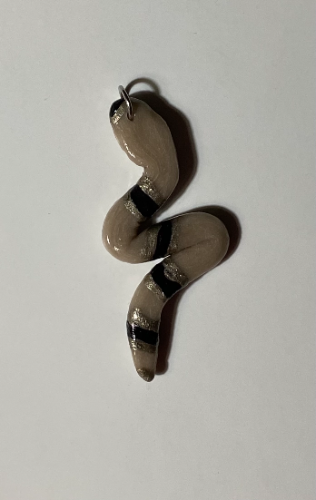 Dije SERPENT Tierra y negro