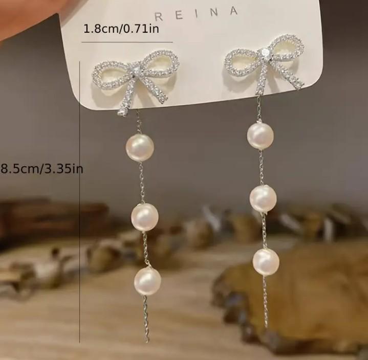 Miniatura 2 de Aretes Blancos Perlas con Moño