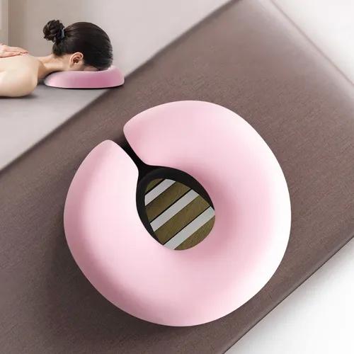 Almohada facial rosada.