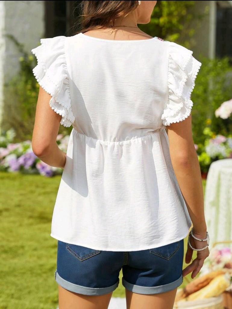 Miniatura 2 de Blusa blanca de embarazada con ribete y bordado de flores