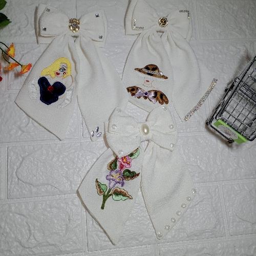 Lazo blanco bordado