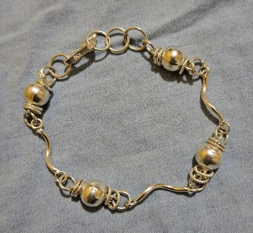 Pulsera 4 cuentas con unión oblicua