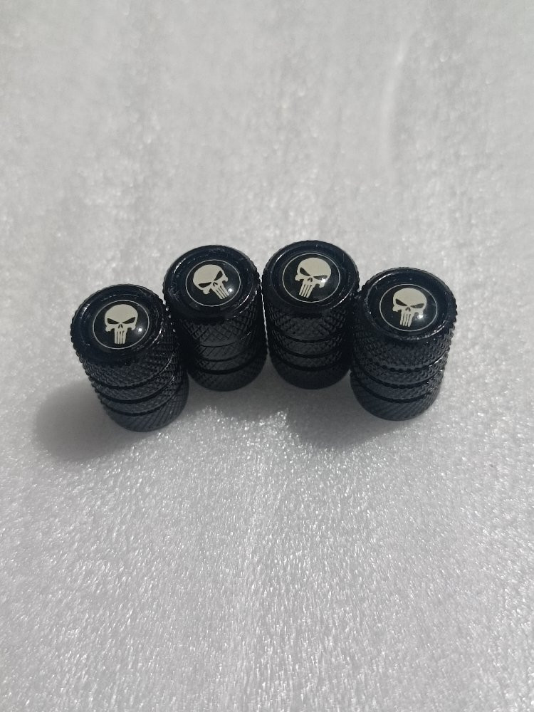 Imagen 1 de JUEGO DE 4 TAPA VALVULAS CALAVERA NEGRA / BLANCO