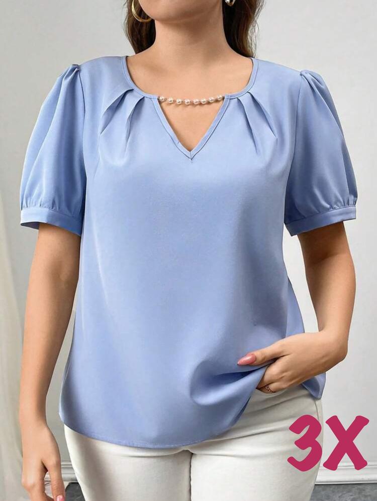 Imagen 1 de Blusa celeste con adorno de perlas