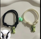 2 pulseras con dijes de dinosaurio S